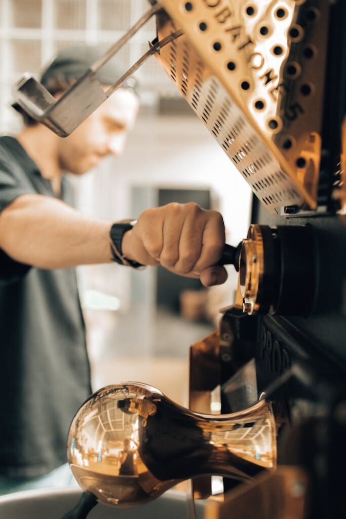 close-up-of-man-operating-a-machine-at-a-coffee-roasting-factory-4816461 Close-up of Man Operating a Machine at a Coffee Roasting Factory